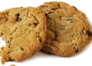 two-chocolate-chip-cookies-one-with-bite-out-of-it