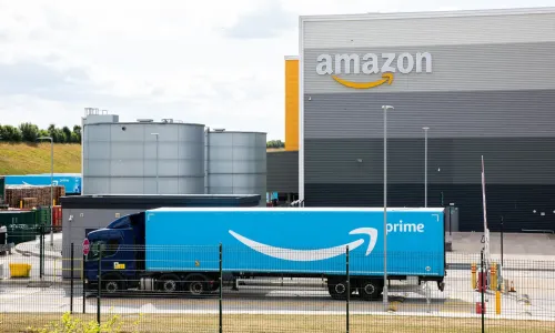 Amazon lorry in front of warehouse